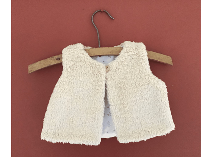 Gilet berger réversible tissu fausse fourrure beige  et tissu coton dessins enfantins.